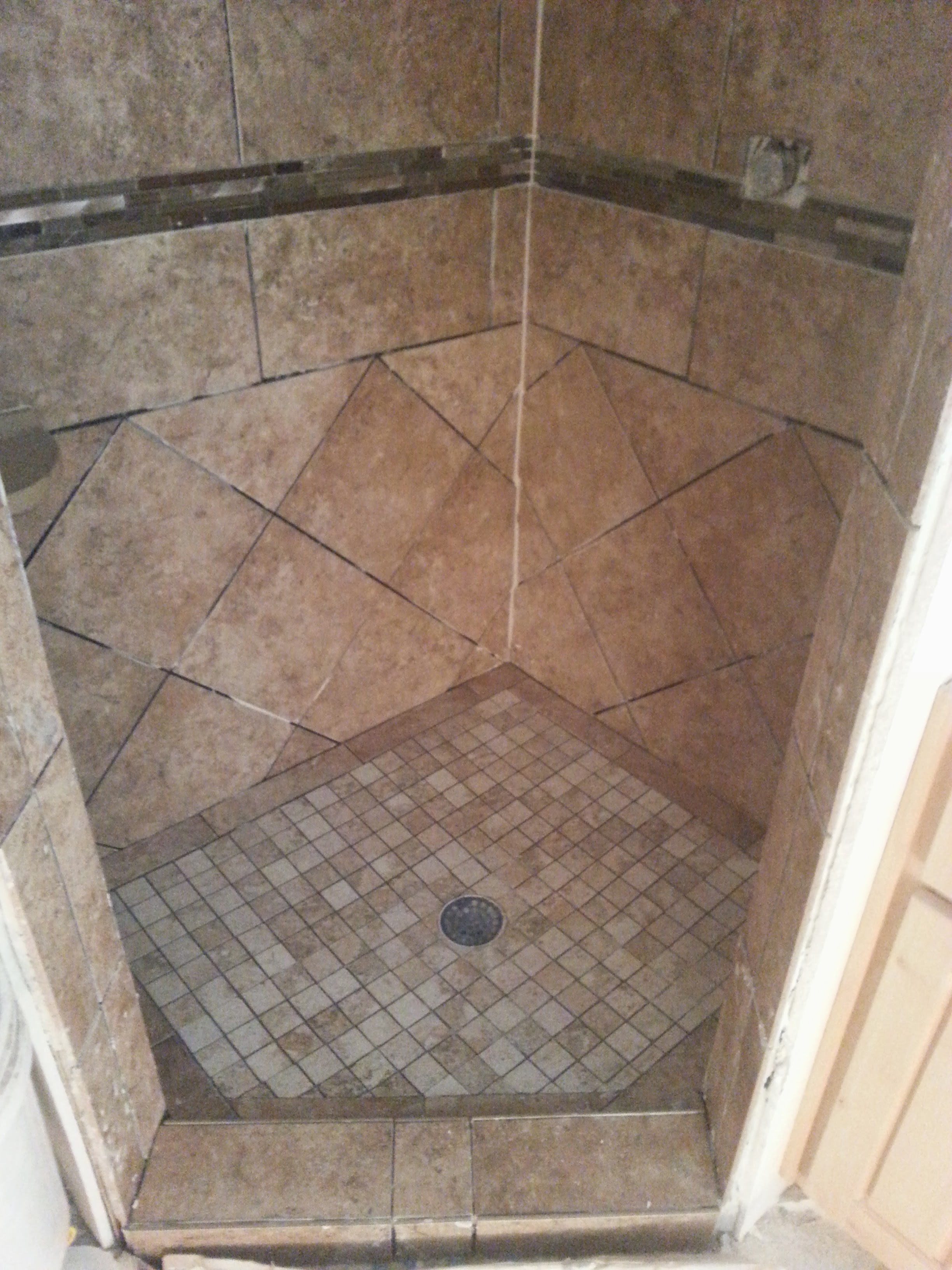 Corner tile shower with mosaic shower pan